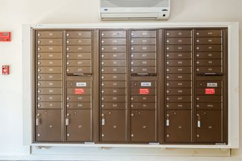 a bunch of lockers on a shelf in a room