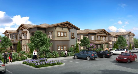 A row of houses with cars parked in front.