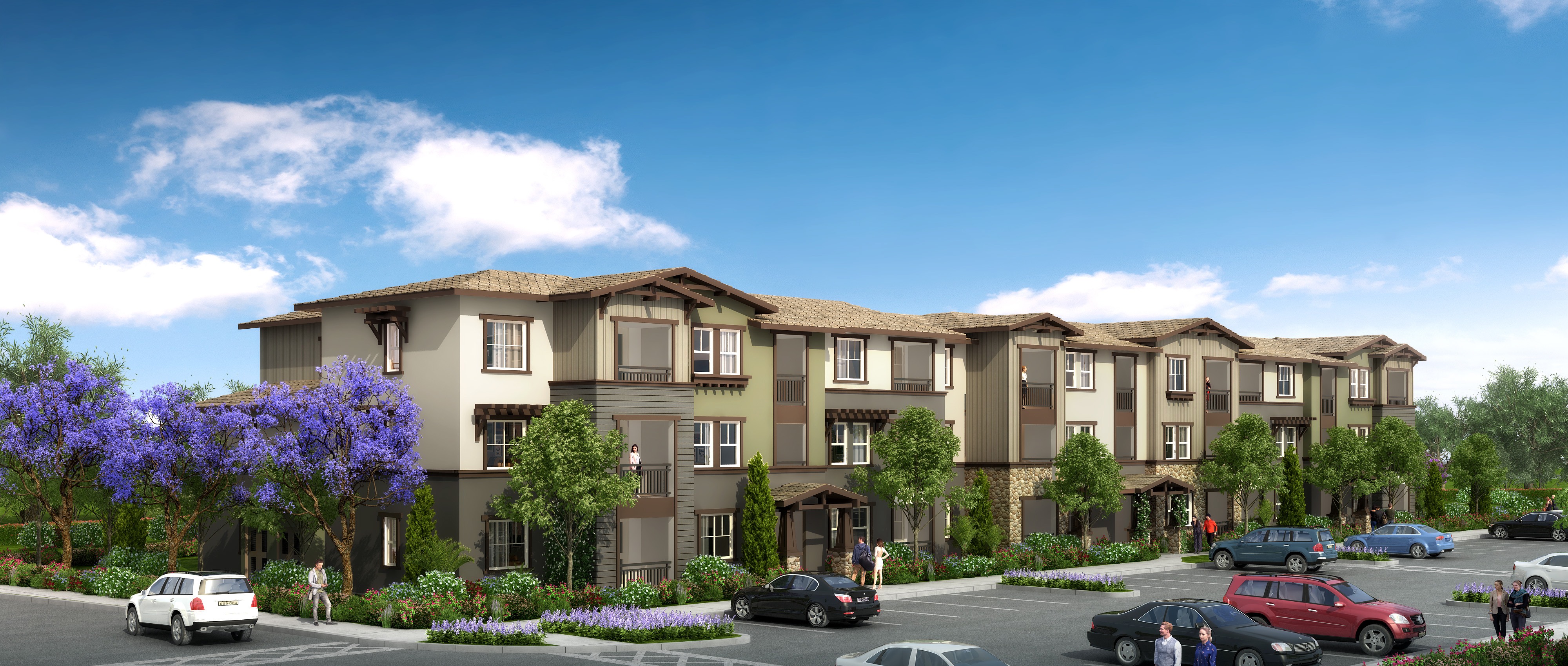 A row of townhouses with cars parked in front.