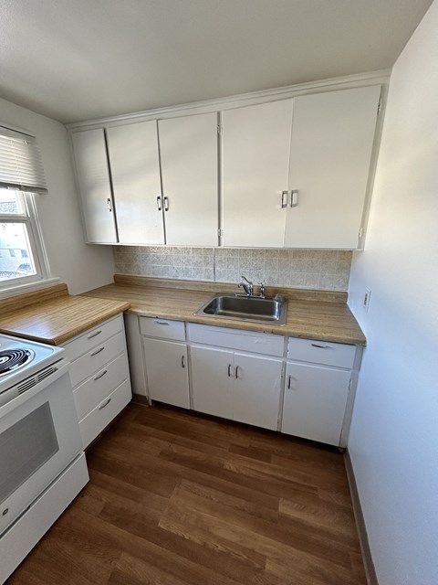 kitchen with white cabinets at Romig Court, Anchorage, AK