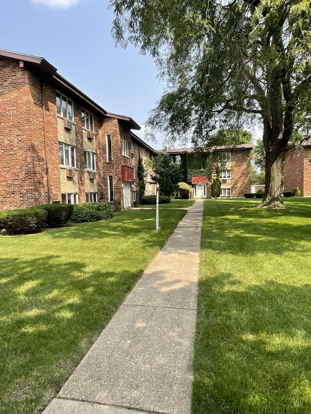 Walkways along buildings and grass at The Countryside, Countryside ?
