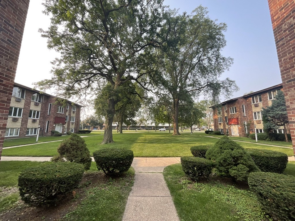 Grass area with walkways between buildings at The Countryside, Countryside Illinois ?