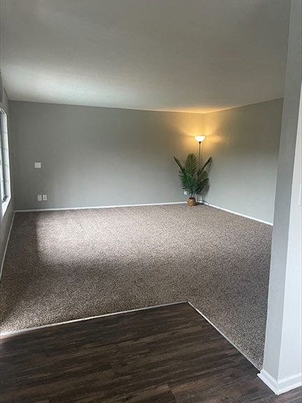 a room with a plant and a lamp in it at Dwell Apartment Homes, California