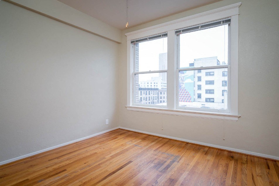 apartment interior with hardwood floors and city views at Maurice Dear Apartments, Portland, OR 97205