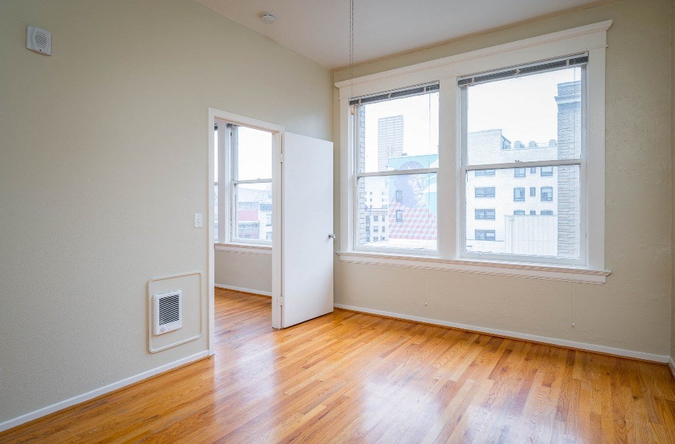 apartment interior with hardwood floors and city views at Maurice Dear Apartments, Portland