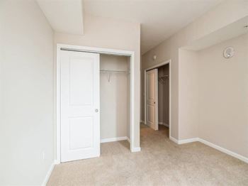 A white door is open to a hallway.