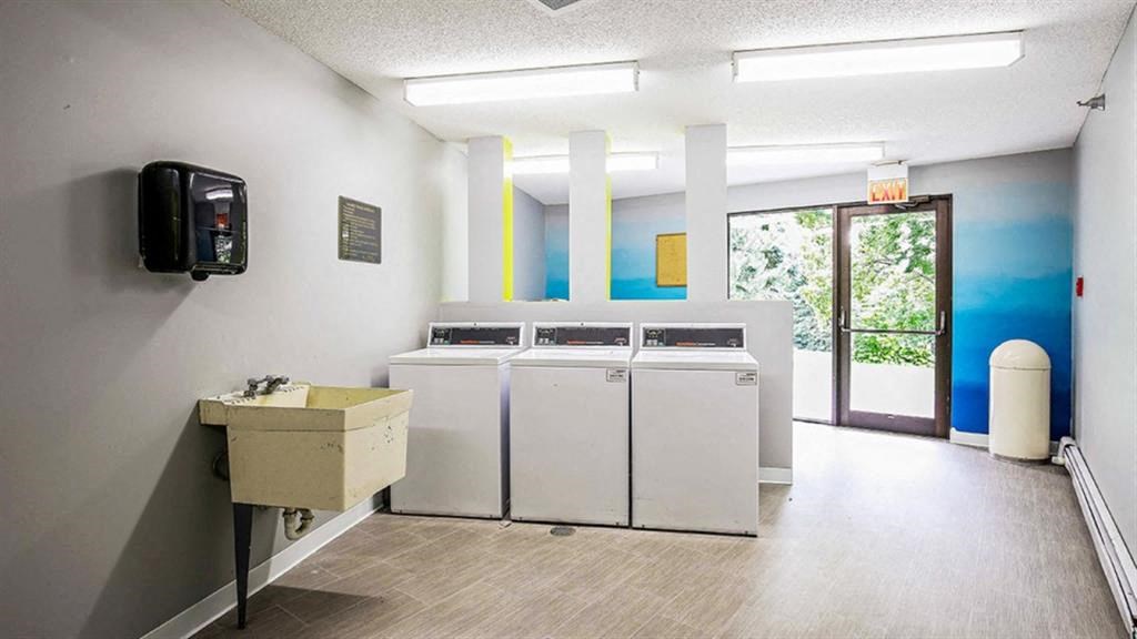 Living room and kitchenat Twelve 501 Apartment Homes, Burnsville, MN
