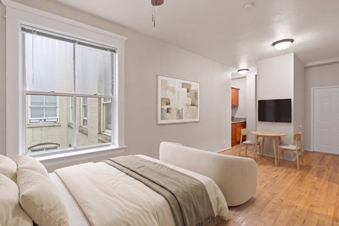 A living room with a couch and a television.