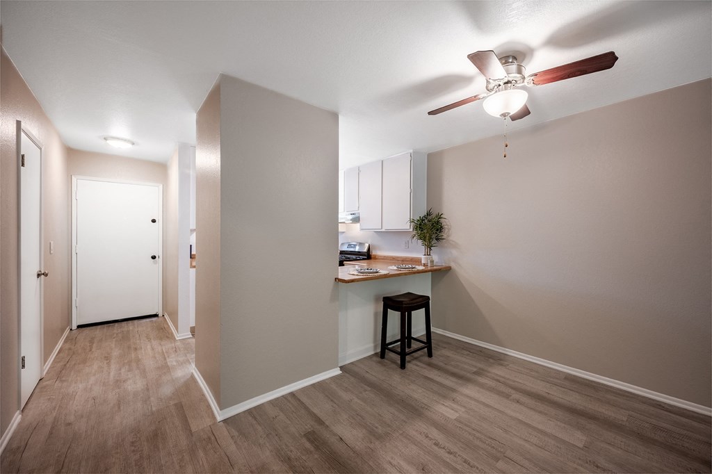 living room and kitchen with ceiling fan at Oak Park Apartments, Solvang, 93463