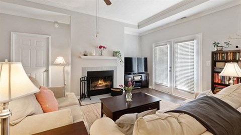 a living room with a fireplace and a couch