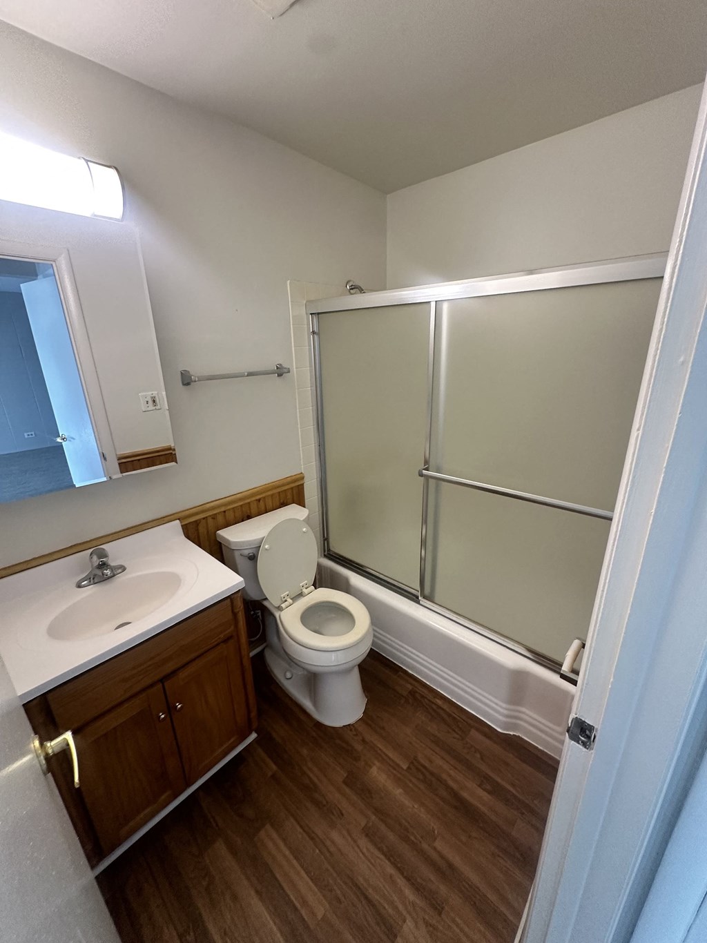 a bathroom with a toilet and a shower at River Oaks, North Aurora, Illinois
