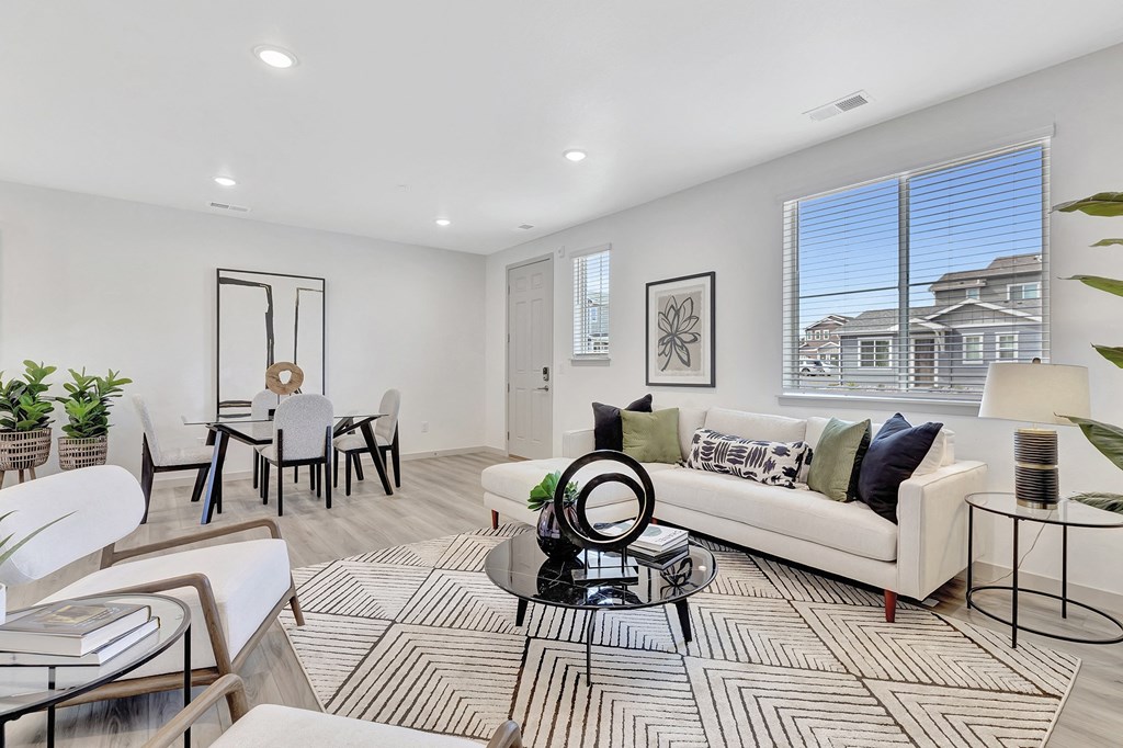 Living room with a couch and a dining room table