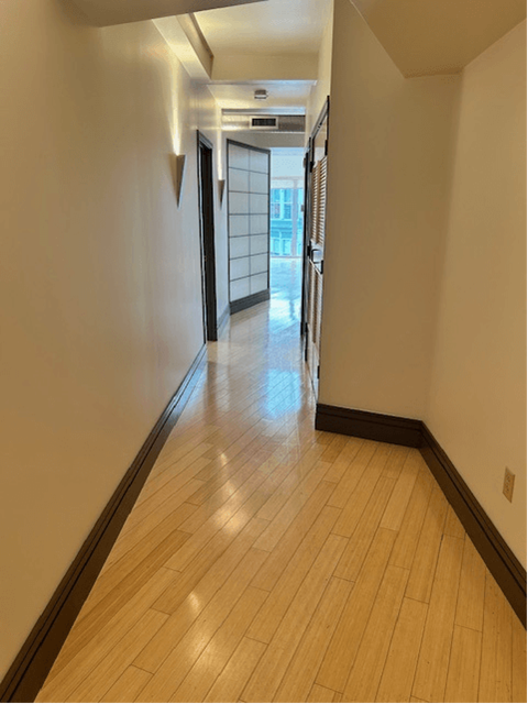 a hallway with wood flooring