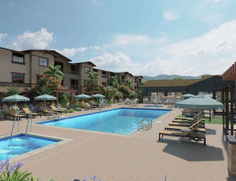 A large swimming pool surrounded by lounge chairs and umbrellas.