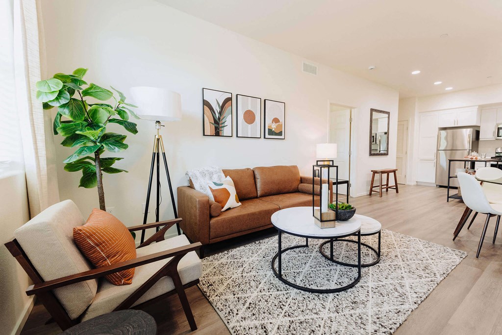 a living room with a couch coffee table and a kitchen in the background at Arrive Paso Robles, California, 93446