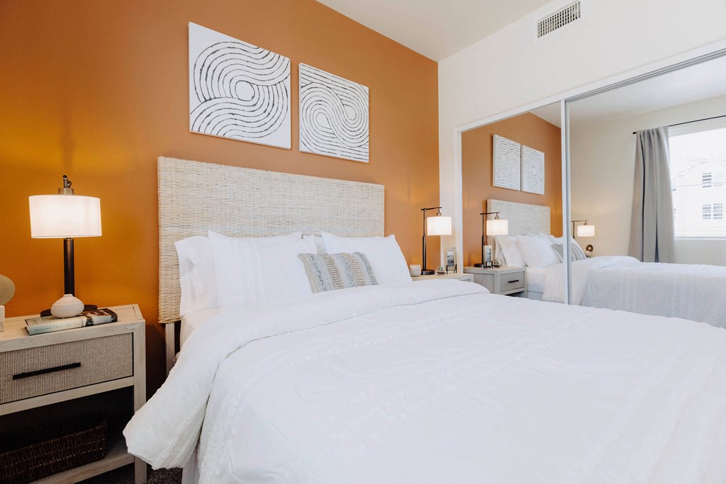 a bedroom with a large bed and a mirror at Arrive Paso Robles, California