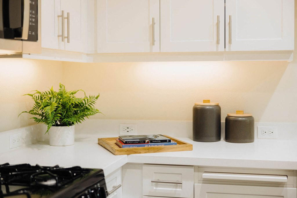 a kitchen with white cabinets and white countertops  at Arrive Paso Robles, Paso Robles, CA, 93446