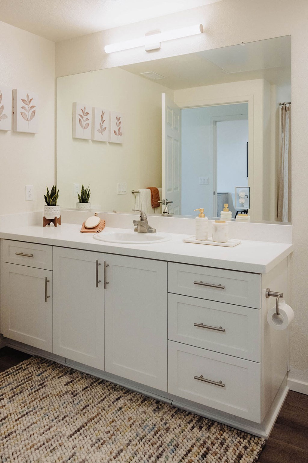 a bathroom with white cabinets and a large mirror  at Arrive Paso Robles, Paso Robles, 93446