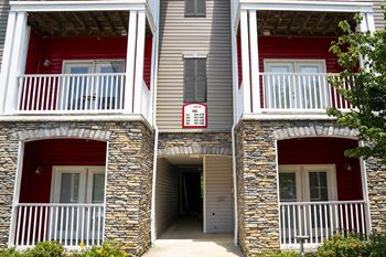 a red and white building with a sign on the side of it