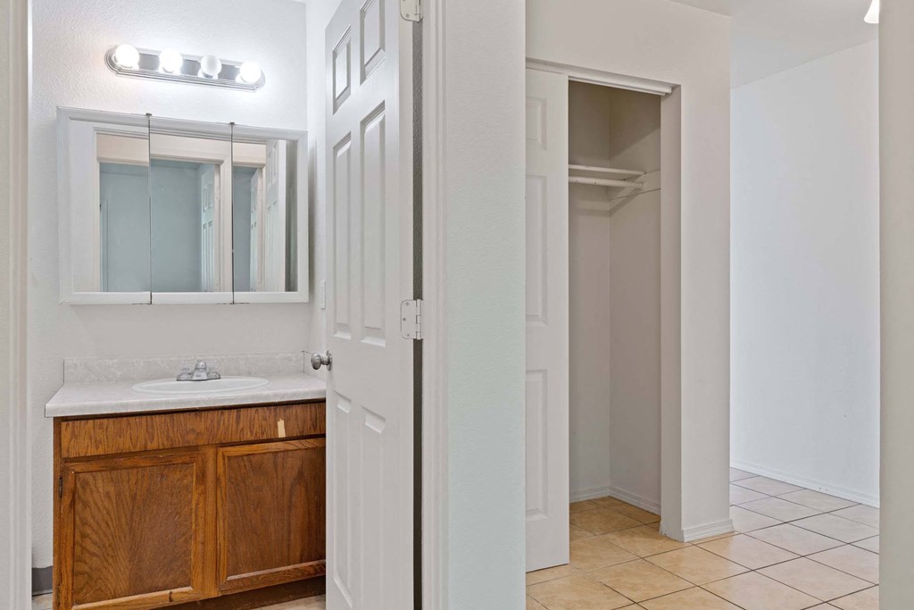 a bathroom with a sink and a mirror at ReNew Eagle River, Alaska