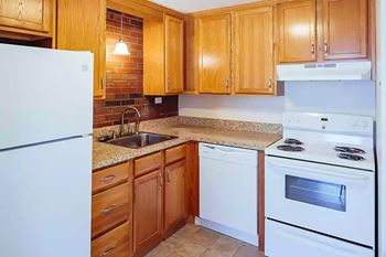 a kitchen with white appliances at Stonebridge, Ellington, CT, 06029