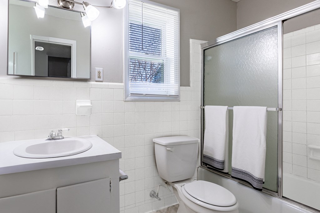 a white bathroom with a shower toilet and sink at Sharon West, Charlotte, 28210