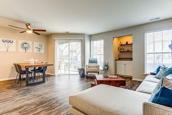 a living room with a couch and a dining table