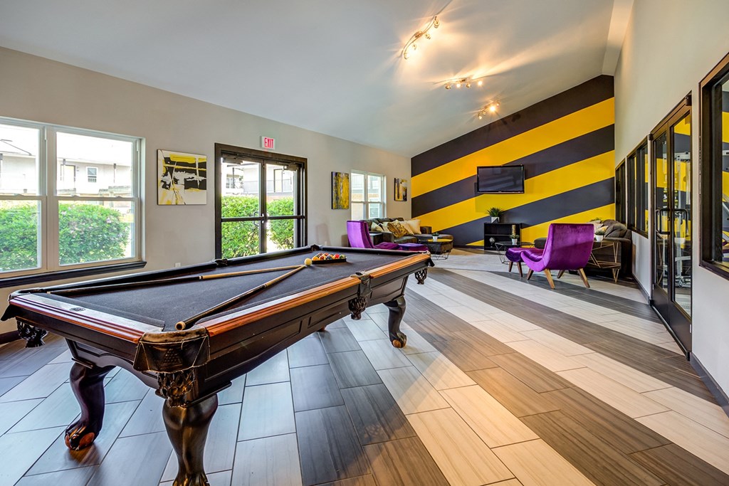 a games room with a pool table and a piano at The Hub at Baton Rouge, Louisiana, 70808