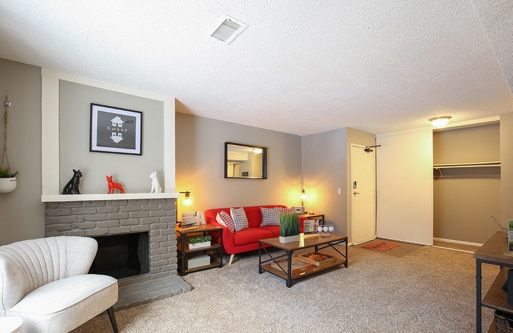 a living room with a couch and a fireplace
