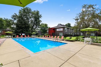our apartments offer a swimming pool with chairs and umbrellas at The View Apartments St Charles, St Charles, 60174