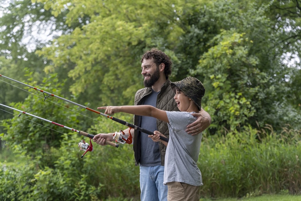 a man and a child fly fishing