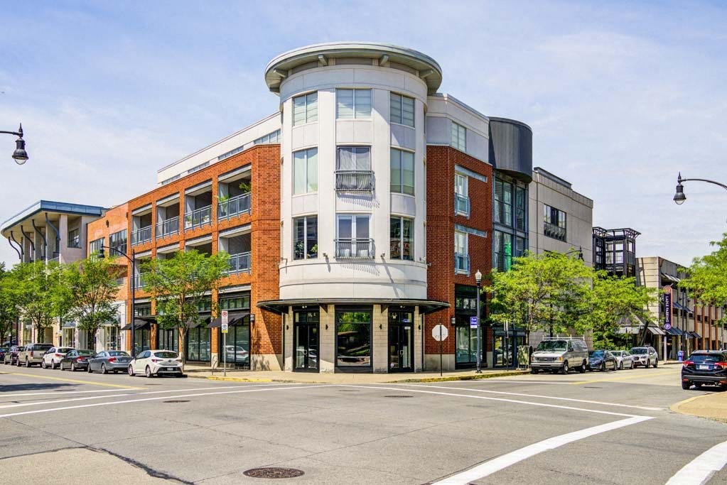 a building on the corner of a street with cars parked in front of it at Flats at Southside, Pittsburgh, 15203