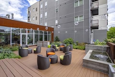 Outdoor Lounge with water fountain at Track 29 Apartments, Minneapolis