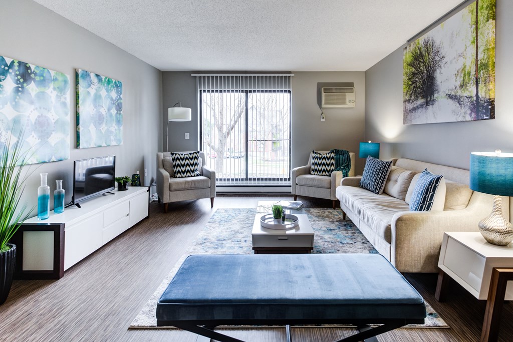 our apartments offer a living room with a couch coffee table and tv