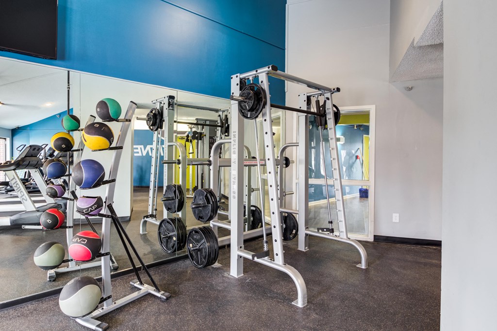 a gym with weights and other exercise equipment