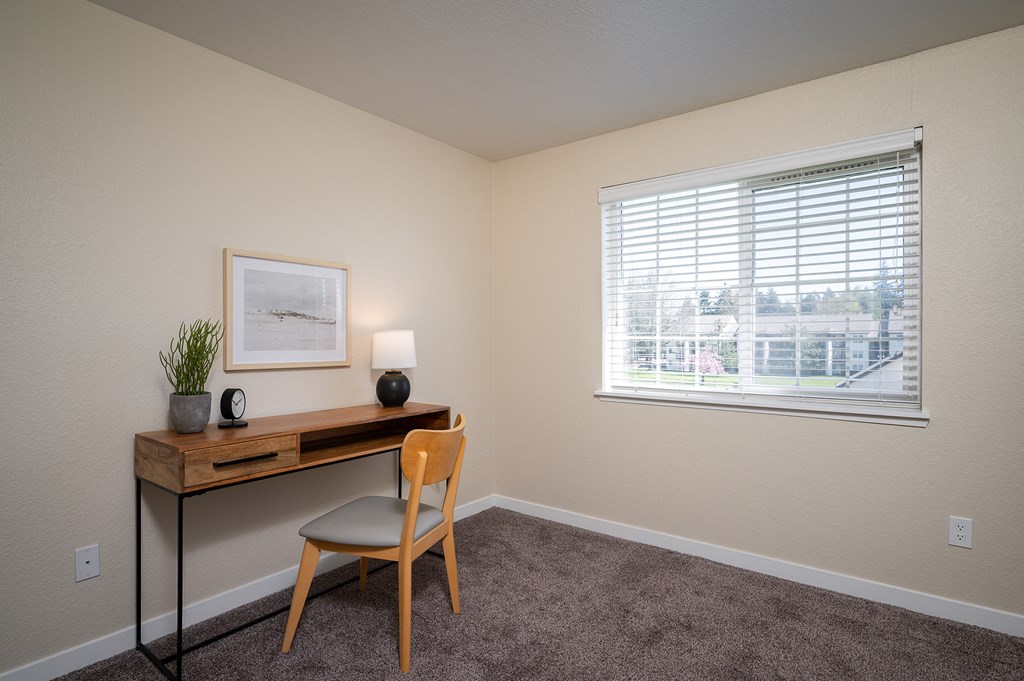 an office with a desk and a window at Sundial Apartments, Wilsonville, OR