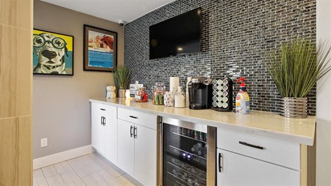 a kitchen with a counter and a television