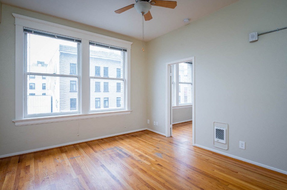 apartment interior with hardwood floors and city views at Maurice Dear Apartments, Oregon, 97205