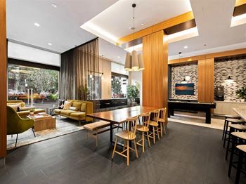 a dining room with a table and chairs in front of a fireplace