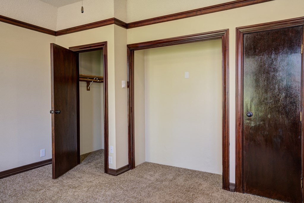 Bedroom with closets and two doors at Whitney Gray, Portland, OR ?