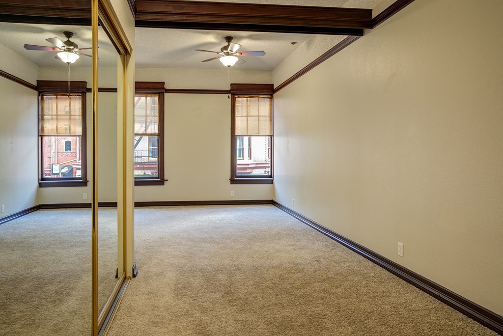 the living room of an empty home with a mirrored door at Whitney Gray, Oregon ?