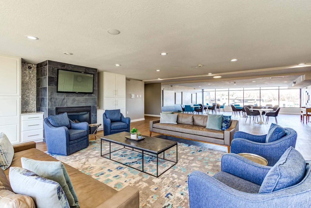 a living room filled with furniture and a large window