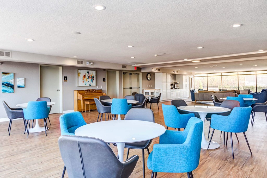 a large room with tables and chairs