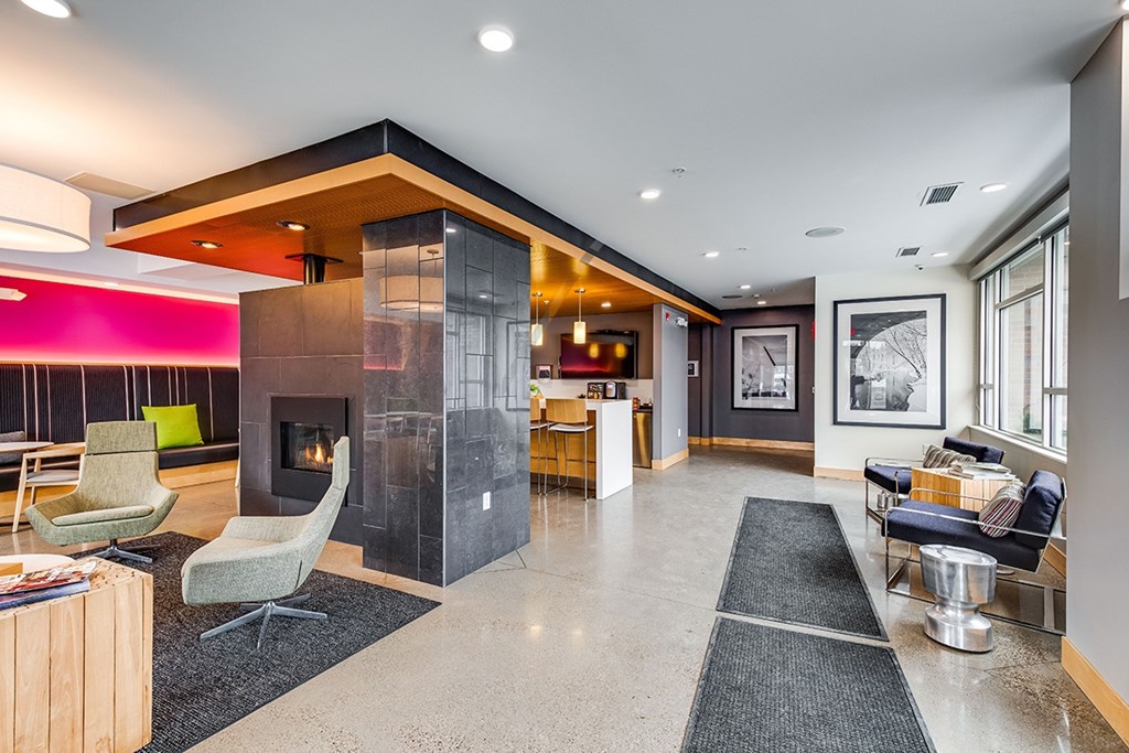 Clubhouse with a fireplace and comfortable seating.