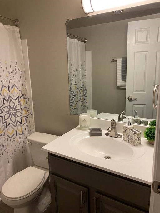 a bathroom with a toilet sink and shower at ReNew Odenton, Maryland, 21113