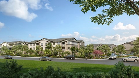 A row of houses with cars parked in front.