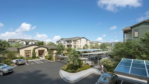 A sunny day at a residential complex with cars parked and solar panels on the roof.