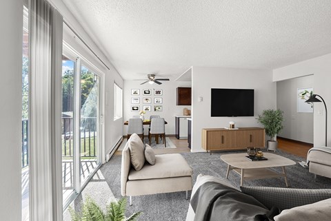 A modern living room with a grey sofa and a wooden coffee table.