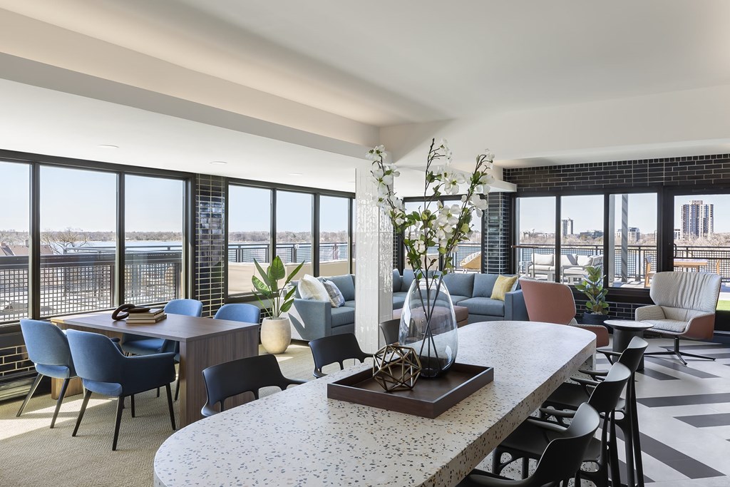 A lounge room with tables and chairs