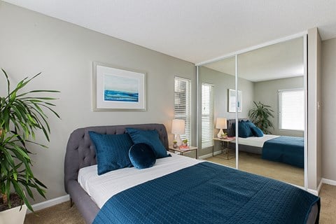 Furnished bedroom interior at OceanAire Apartment Homes, Pacifica